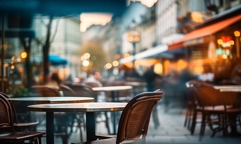 table and chair on the outside of a cafe